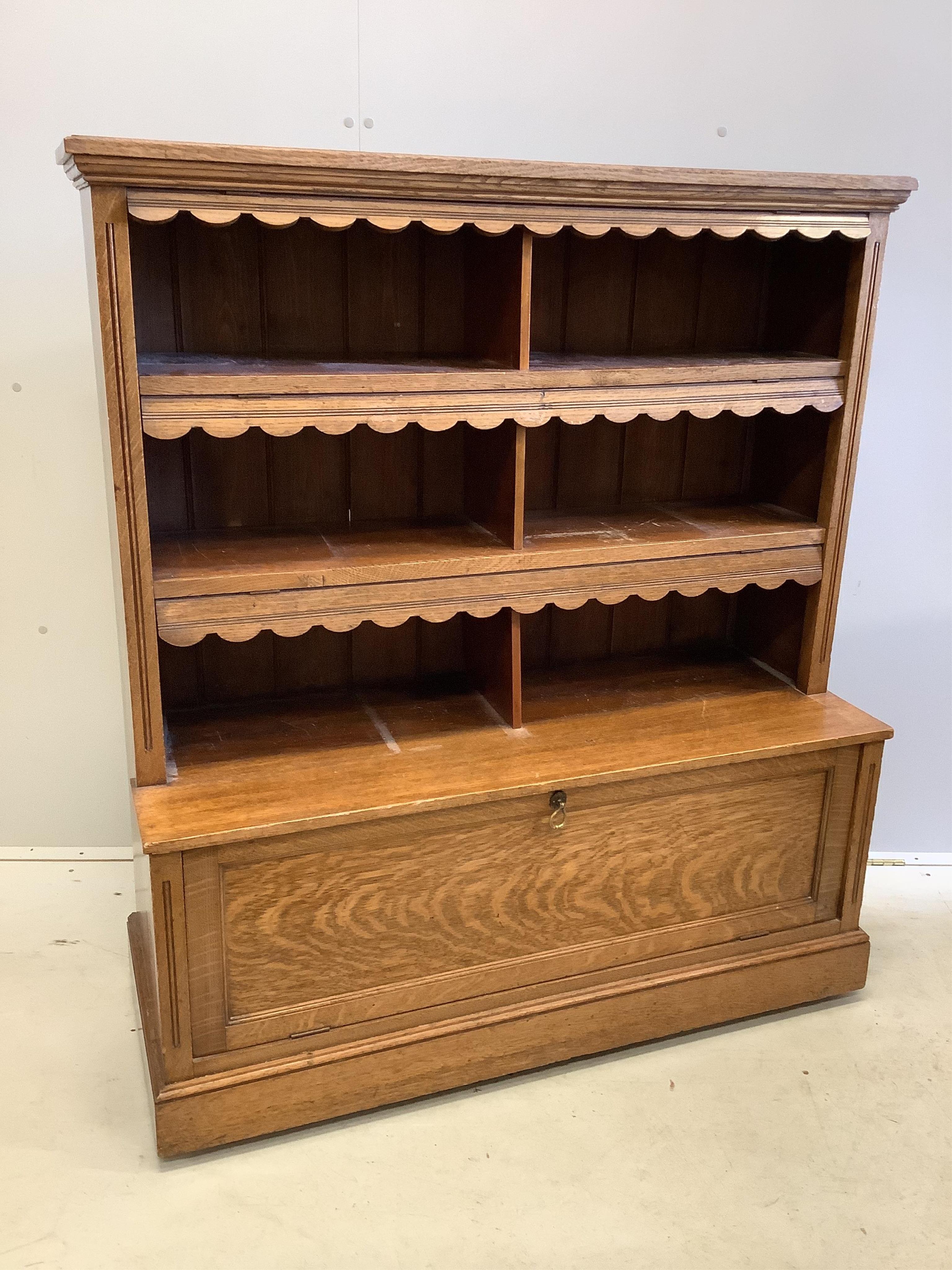 An Edwardian oak bookcase, width 108cm, depth 42cm, height 124cm. Condition - fair